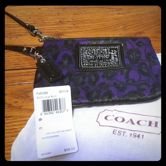 Coach Handbags - Coach Ocelot Purple Animal Print Wristlet